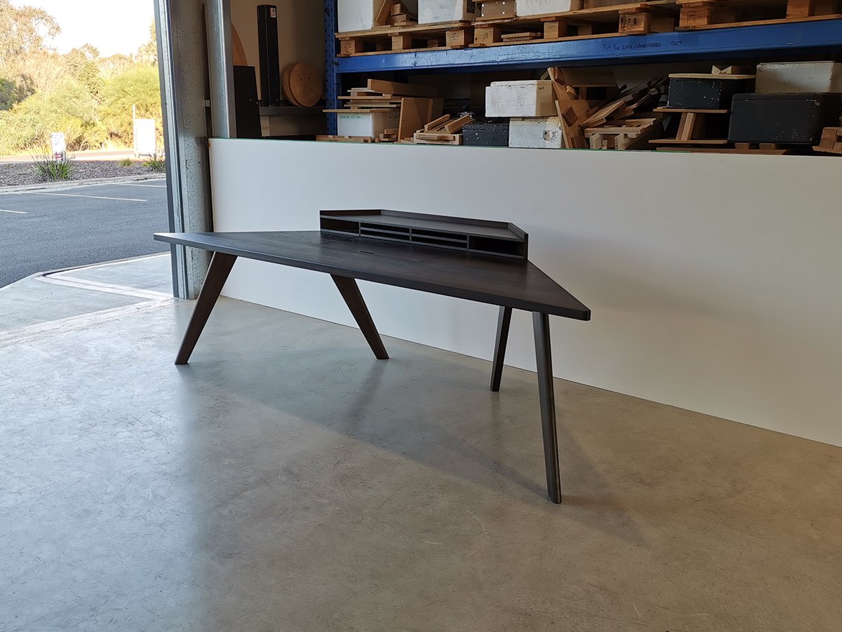 Vista St Desk in ebonised Tasmanian Blackwood, full side view in workshop loading area - Nathan Day Design