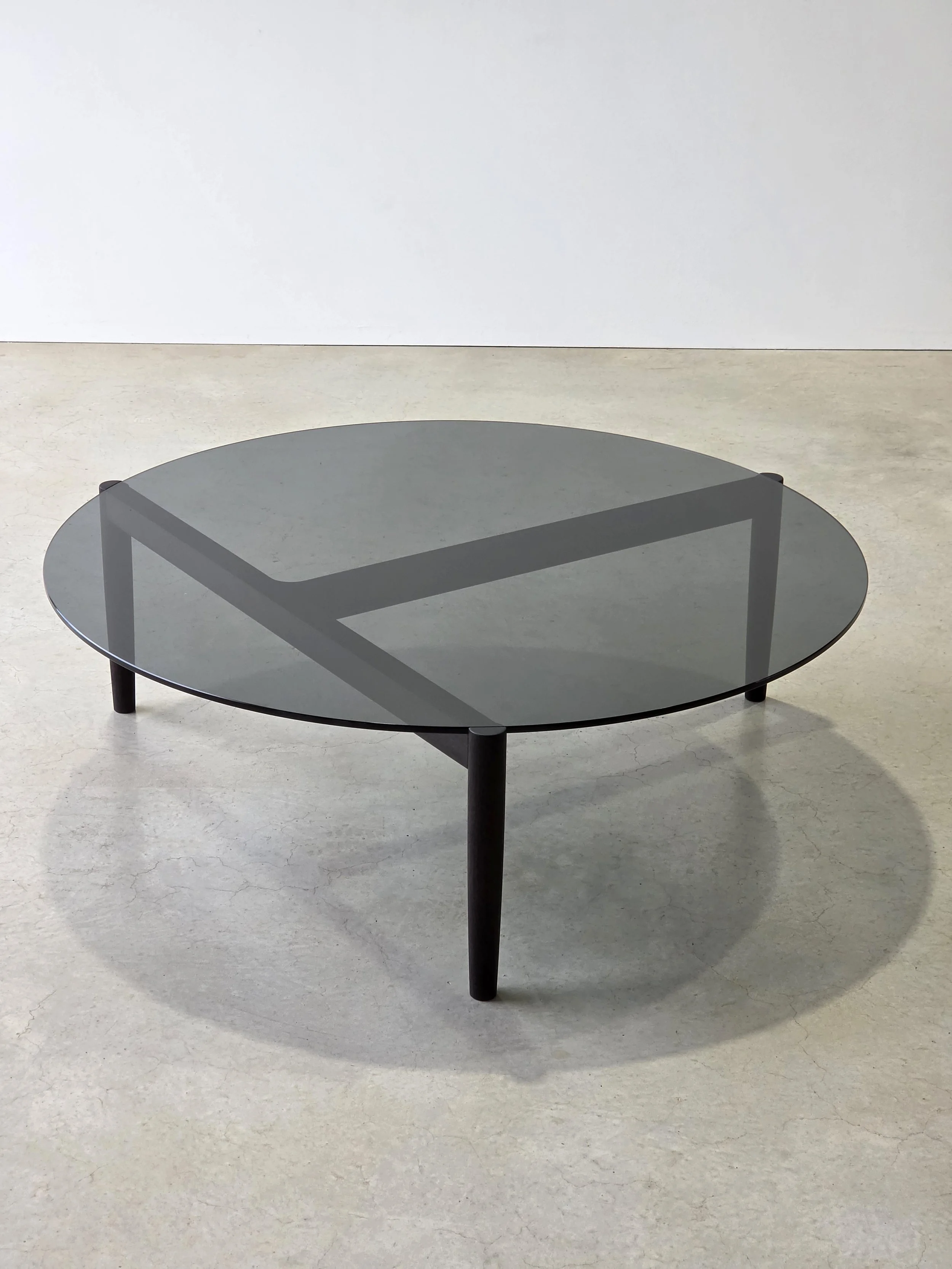 3.2.1 Coffee Table in ebonised Jarrah with tinted glass top, studio shot showing the rail detailing - Nathan Day Design