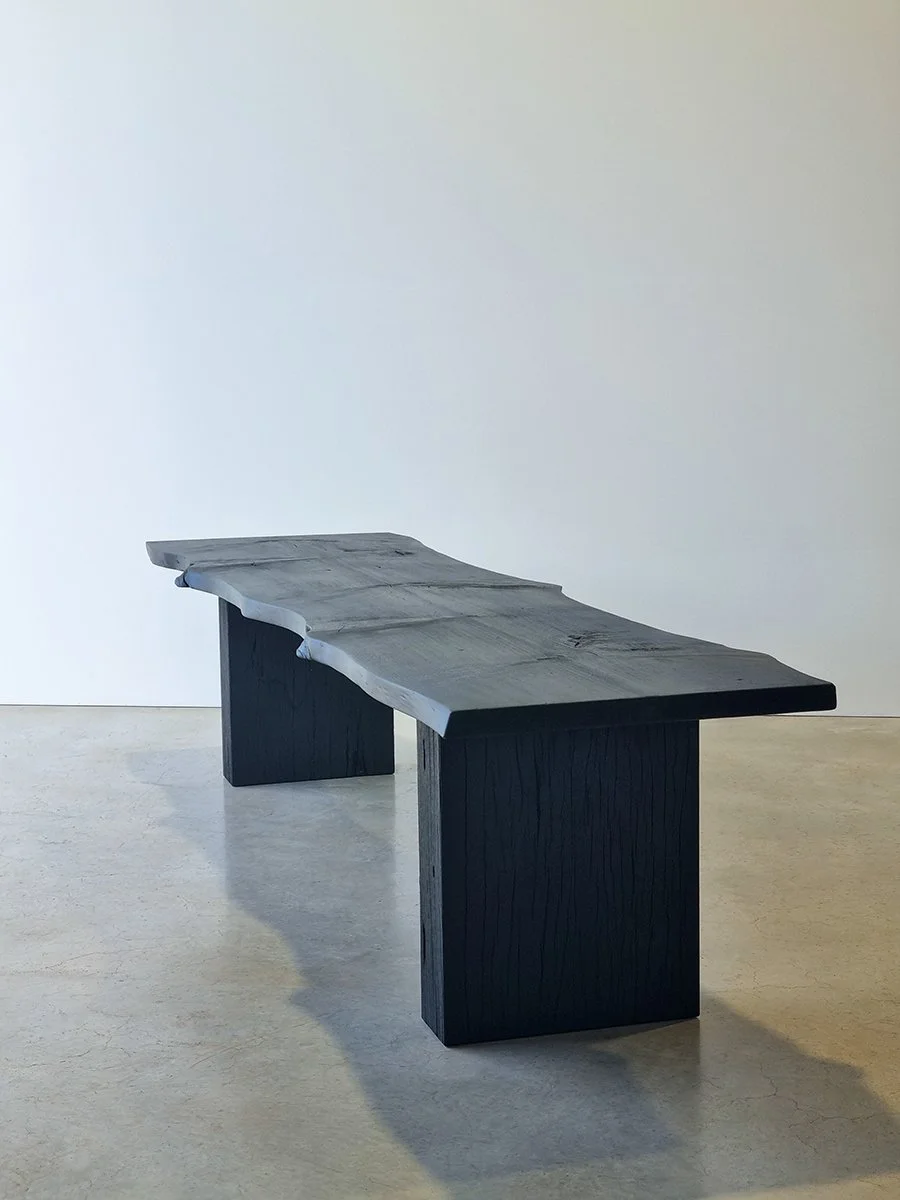 Full-length view of Burnside Bench in scorched Norfolk Island Pine showing both slab legs and natural timber checking - bespoke seating by Nathan Day Design