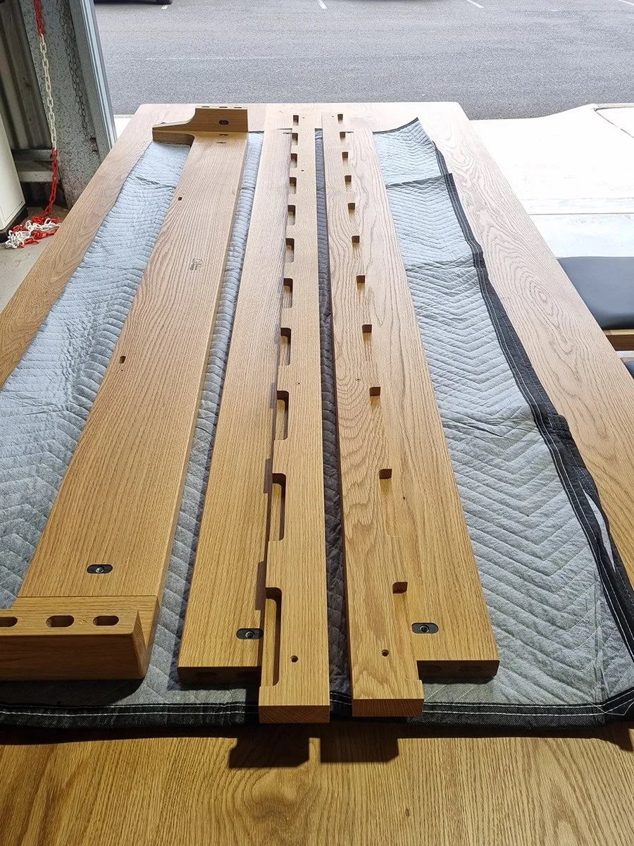 Quindalup Bed in American Oak - Nathan Day Design, workshop shot of slat components with joinery cutouts