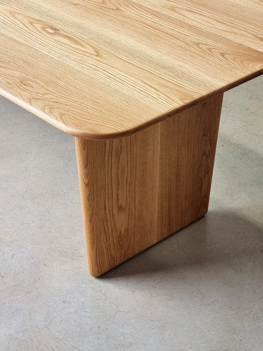 Detail of the Morey Table's softened corner profile and American Oak slab leg - Nathan Day Design