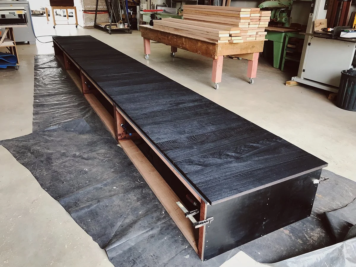 DWER custom furniture in WA Blackbutt - Nathan Day Design, long table under construction showing black steel underframe in workshop
