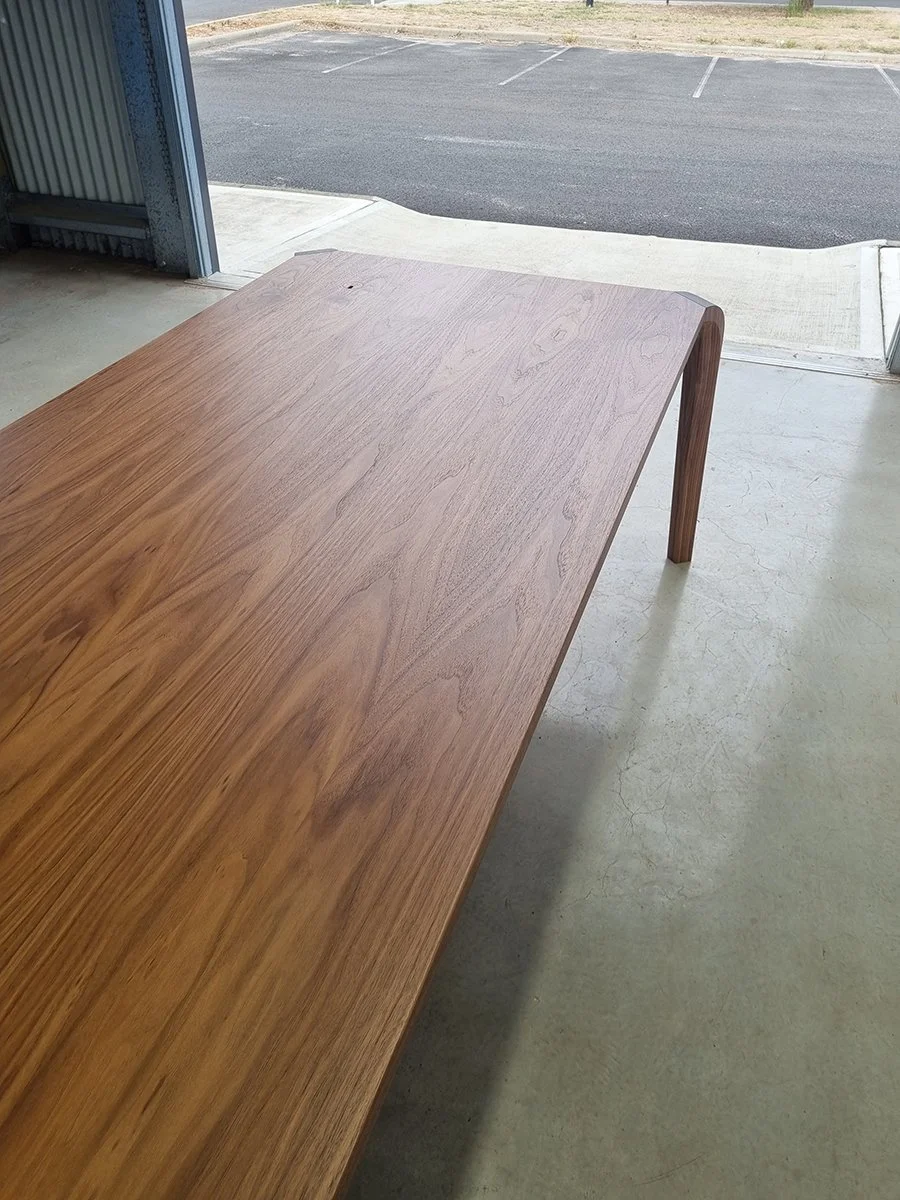 Araluen Desk in American and French Oak, angled tabletop close-up showing rich grain - Nathan Day Design