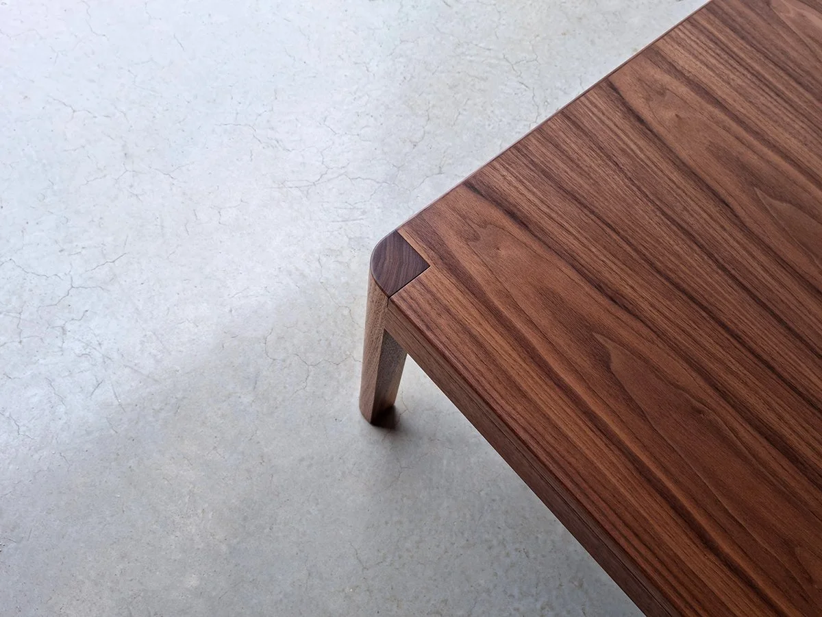 Overhead detail of the Irvine Coffee Table's corner joinery in American Walnut - handcrafted by Nathan Day Design