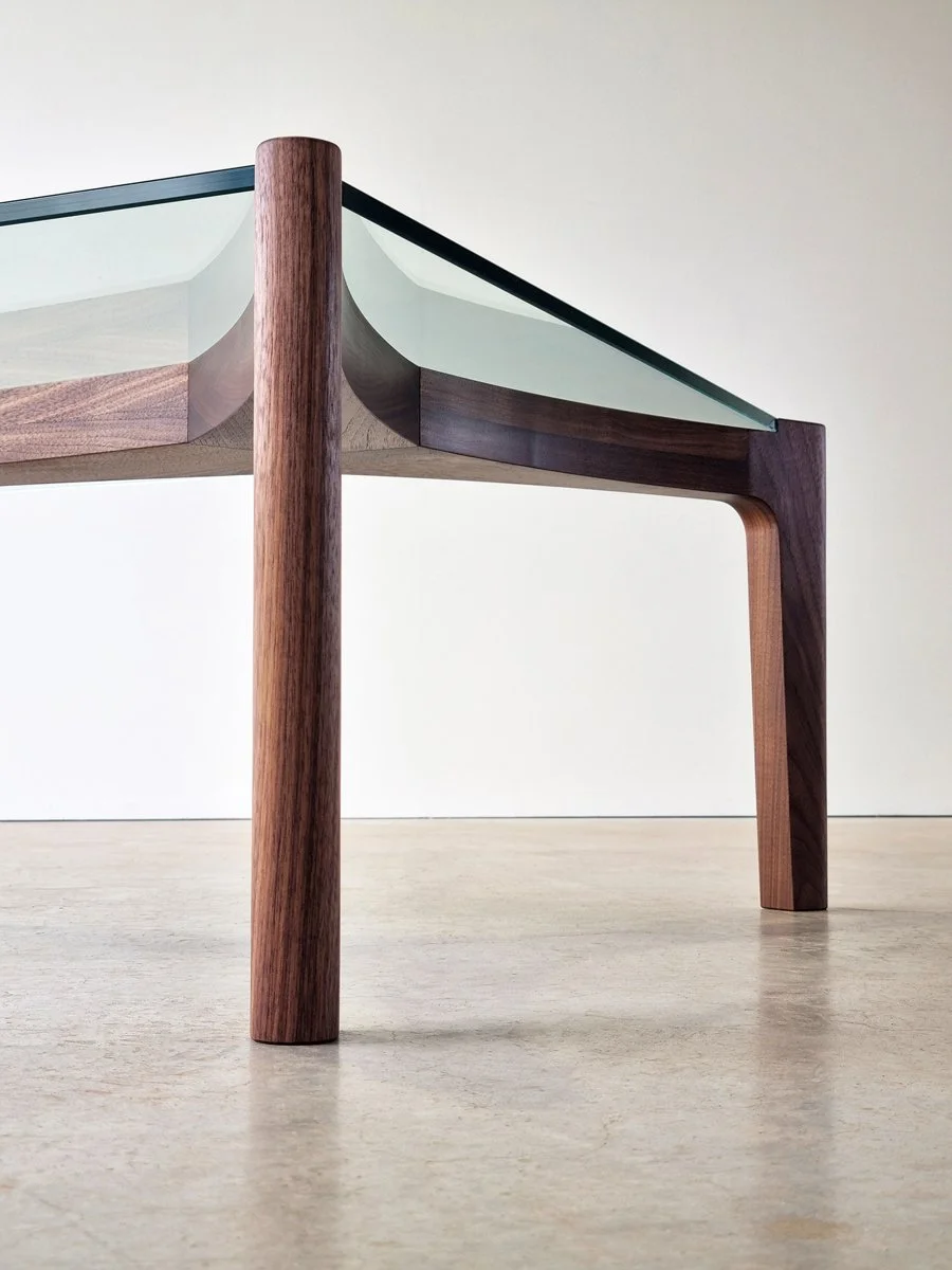 Detail of the Wende Coffee Table's American Walnut leg meeting the glass tabletop - bespoke joinery by Nathan Day Design
