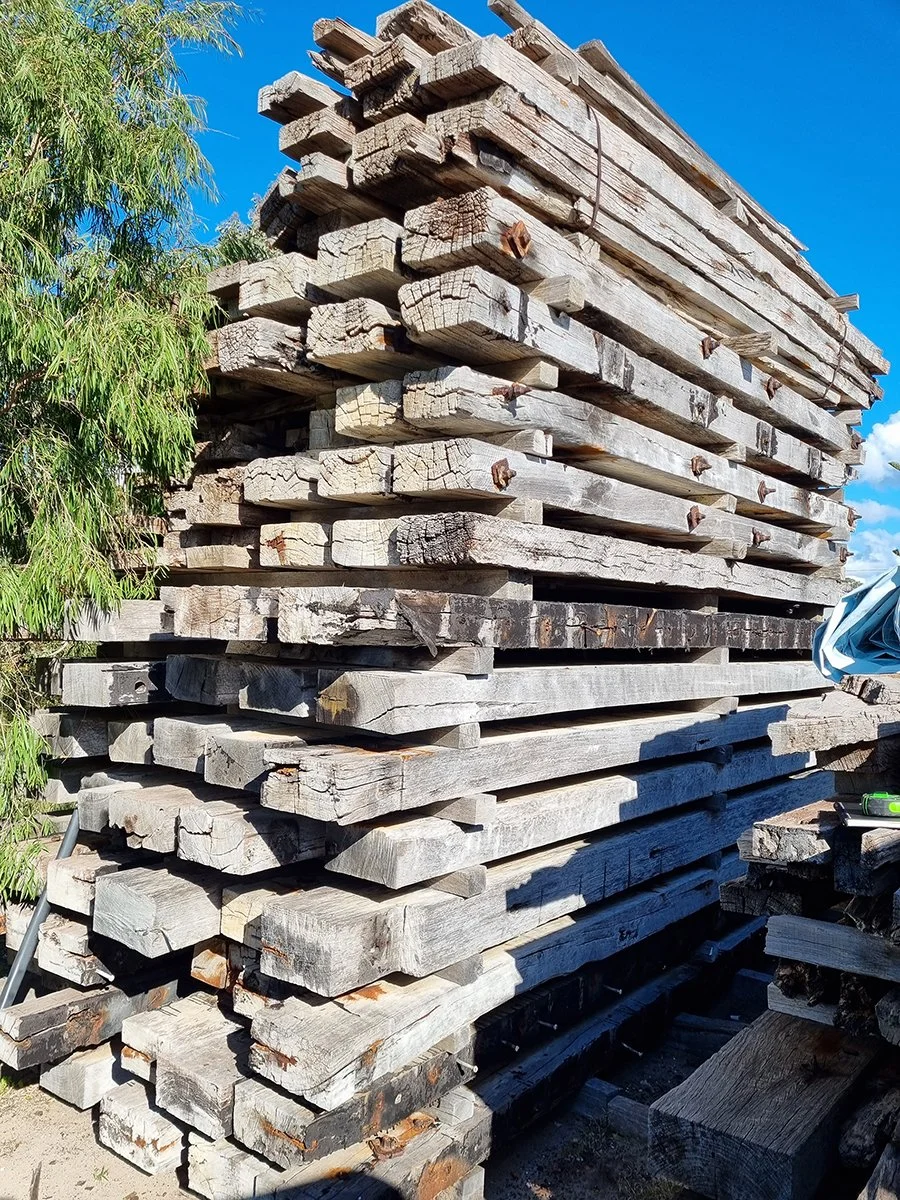 Reception Counter - One The Esplanade in scorched timber - Nathan Day Design, close-up of stacked raw reclaimed sleeper timber