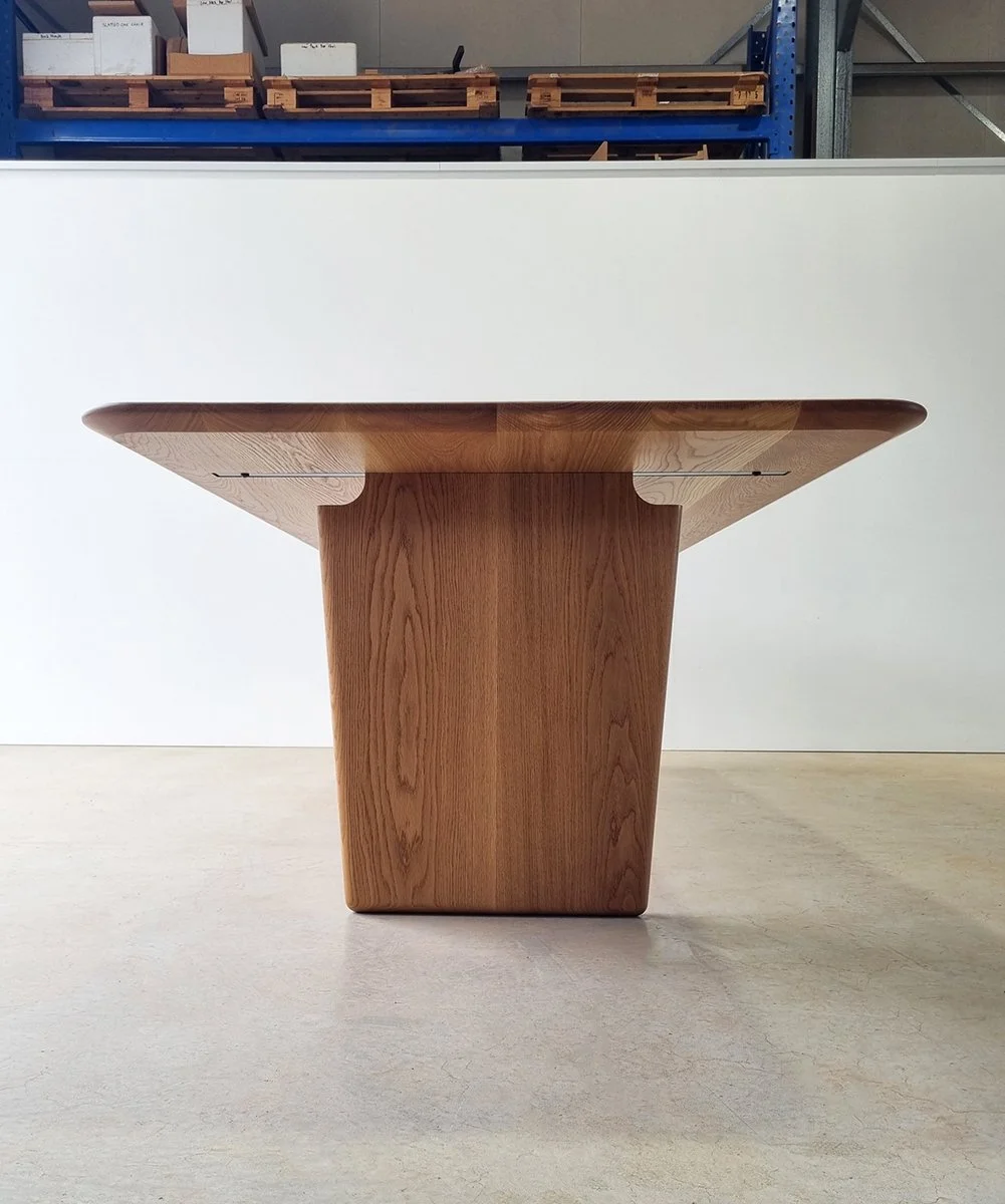 End-on workshop view of the Morey Table in American Oak, showing the extension leaf join detail - Nathan Day Design