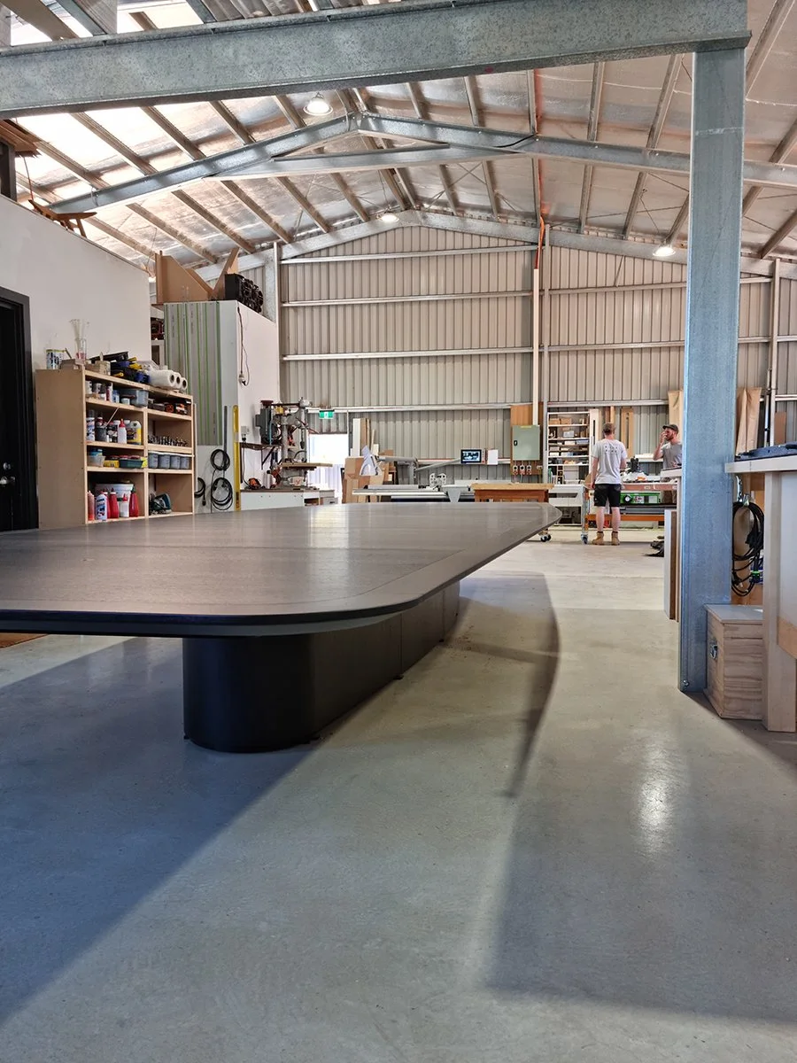 Walters Drive Boardroom Table in ebonised Walnut - Nathan Day Design, full angled view in workshop