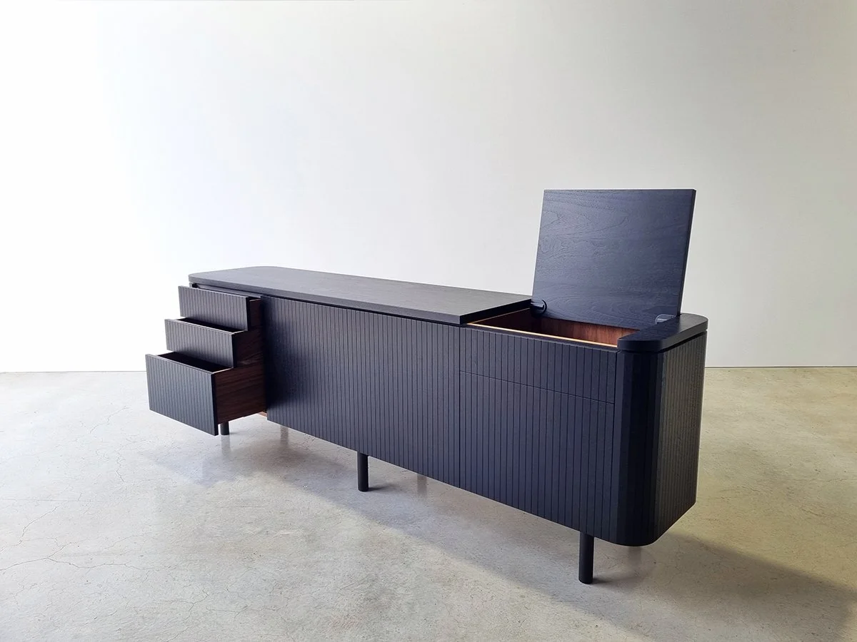 Freeman Loop Credenza in ebonised and natural Walnut, Nathan Day Design bespoke furniture - hinged top and drawer open, plain studio setting