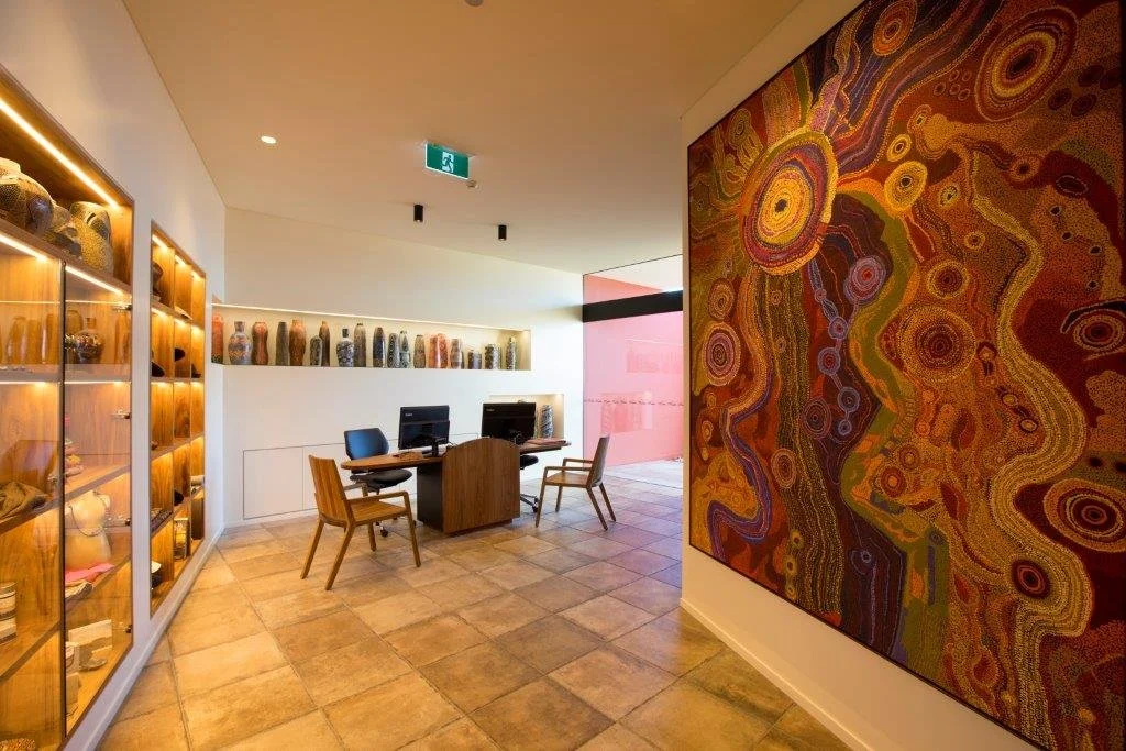 Uluru Chair in Otways Blackwood, Nathan Day Design bespoke furniture - lifestyle setting with colourful mural wall