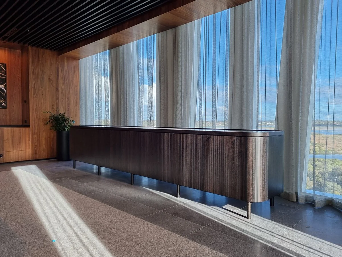 Walters Boardroom Credenza in natural American Walnut, wide installation view in boardroom setting - Nathan Day Design