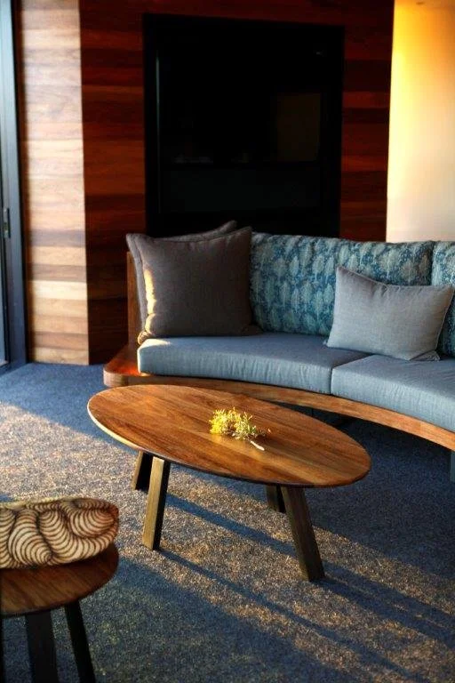 Longitude 131 custom furniture in Tasmanian Blackwood - Nathan Day Design, organic-shaped coffee table with lounge sofa in bar setting