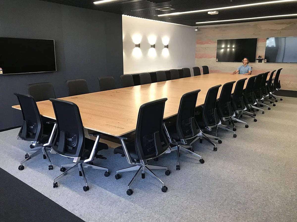 DWER custom furniture in WA Blackbutt - Nathan Day Design, long boardroom table with office chairs and wall-mounted screens