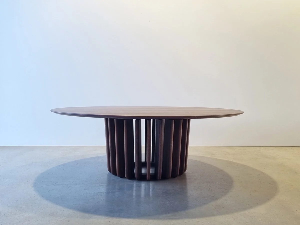 Front-on studio view of the Lantern Table showing the fin base casting light through its gaps - Nathan Day Design