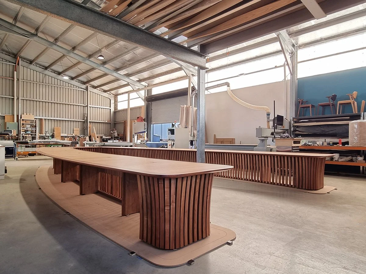 One - The Esplanade Boardroom Table in Australian Blackwood, fluted leg design - Nathan Day Design, completed table end view in workshop