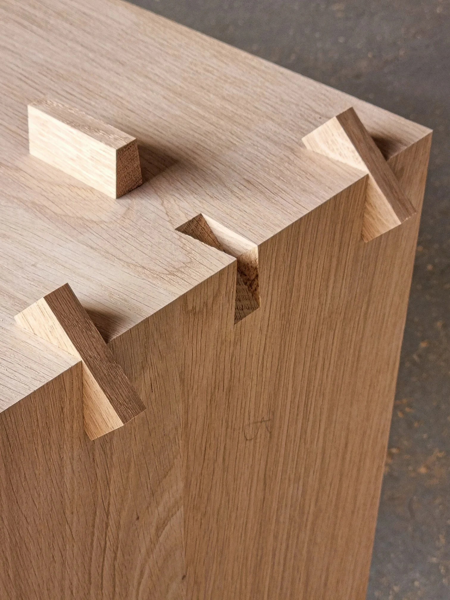 Close-up of a hand-cut dovetail joint showcasing traditional joinery craftsmanship by Nathan Day Design