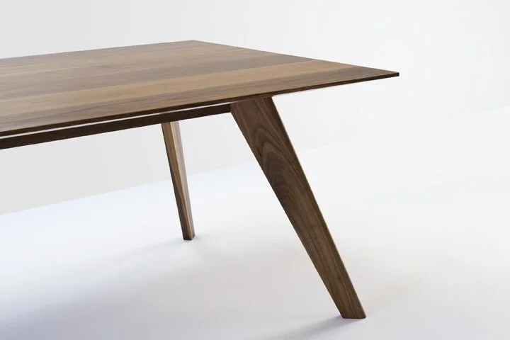 Close-up detail of Vista St Table's sliding dovetail leg construction in Walnut, showing hand-bevelled top edge - bespoke furniture by Nathan Day Design