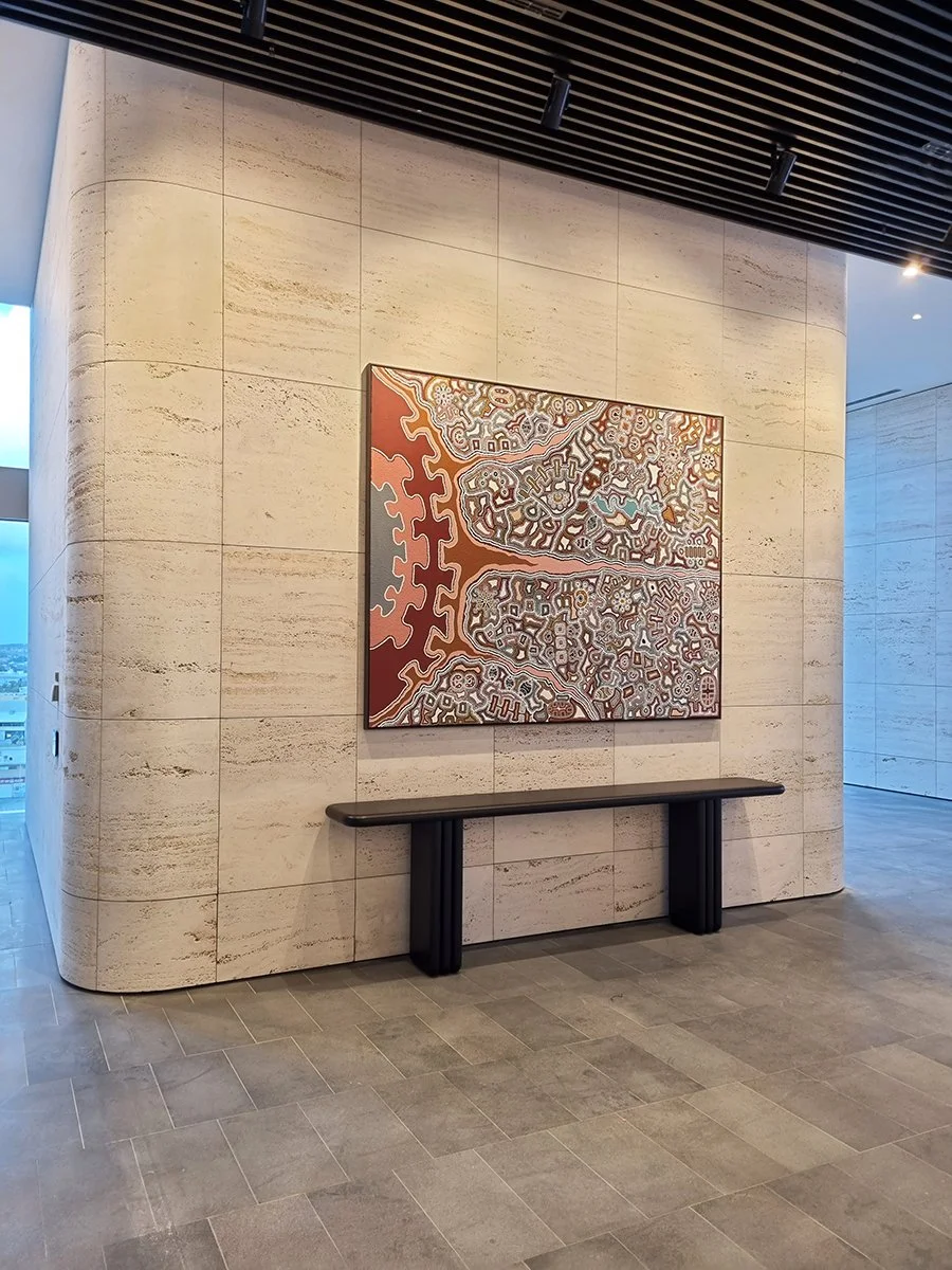 Walters Lobby Console in ebonised Walnut, wide view of full lobby wall with artwork - Nathan Day Design