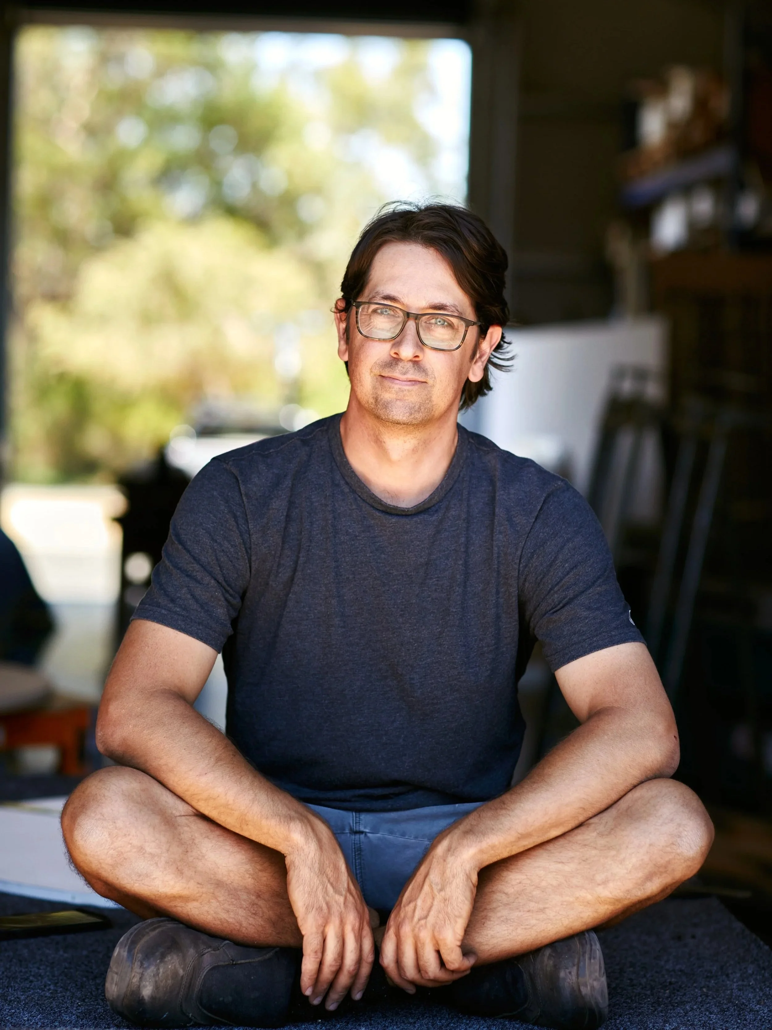 Nathan Day, founder of Nathan Day Design, seated in his Western Australian workshop.