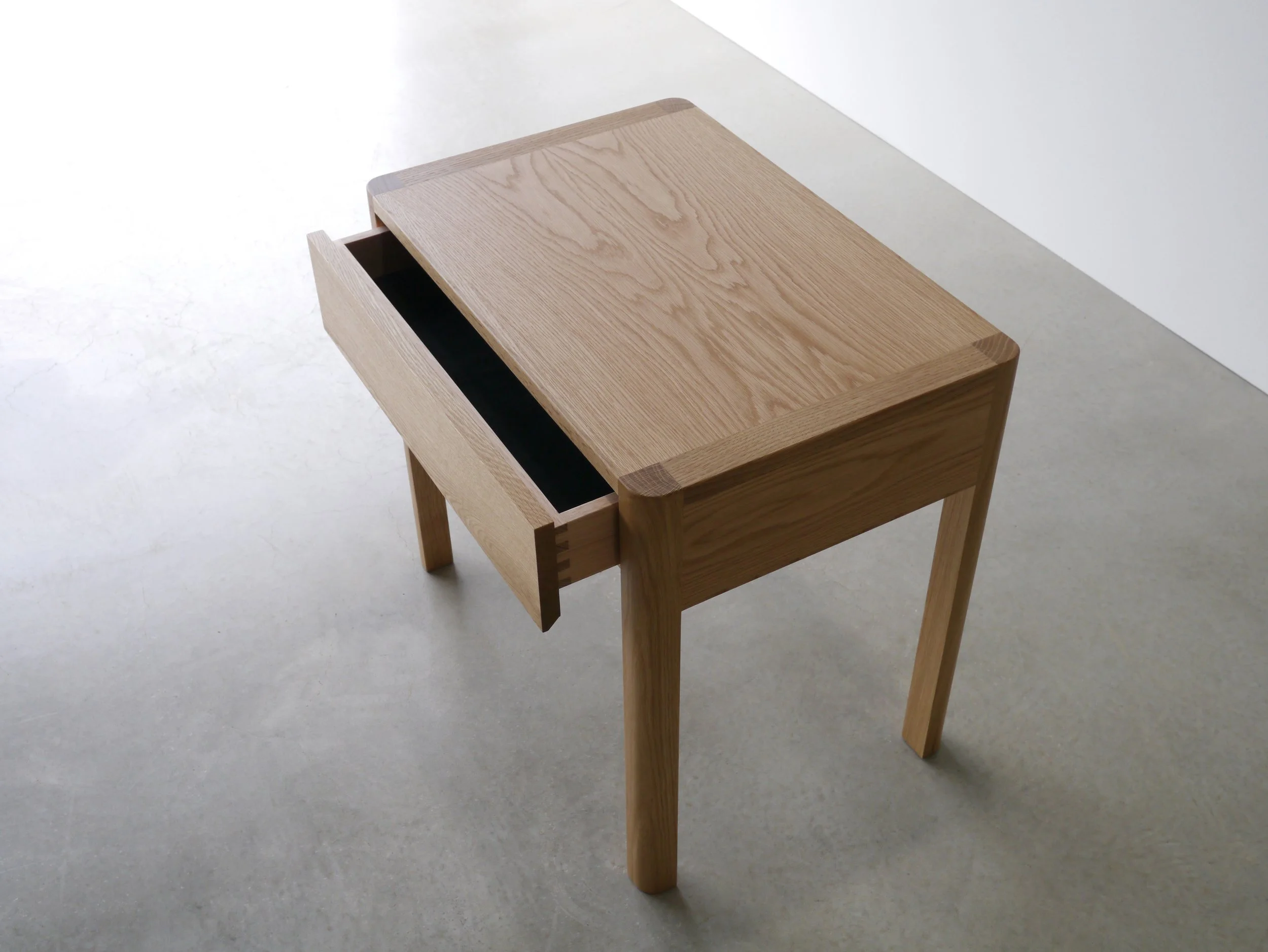 Hampden Bedside Table in Oak - Nathan Day Design, natural finish overhead shot with drawer open
