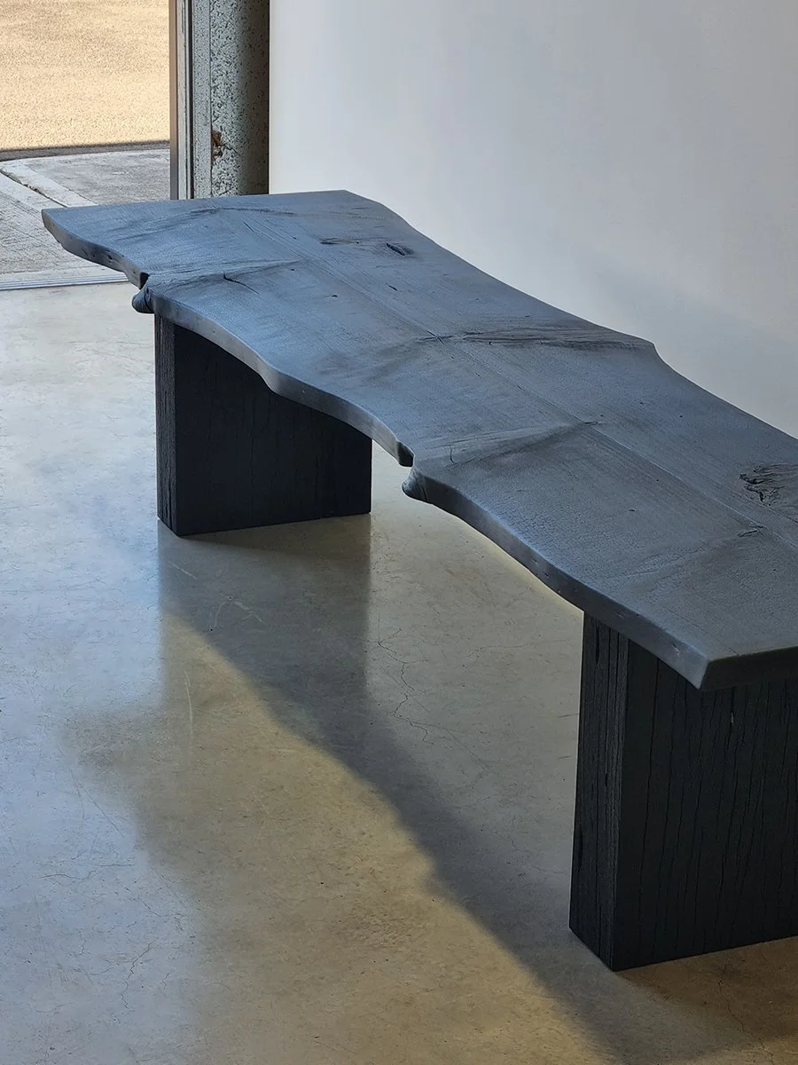 Burnside Bench in scorched Norfolk Island Pine with live-edge top and slab leg, home entry setting - bespoke seating by Nathan Day Design