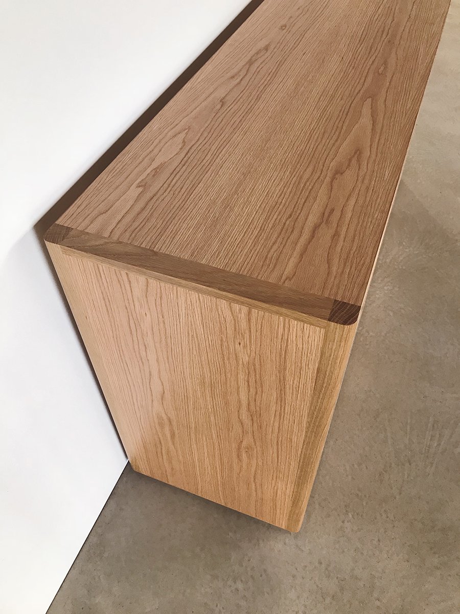 Angwin Record Cabinet in American Oak, close-up mitred corner joinery detail - Nathan Day Design