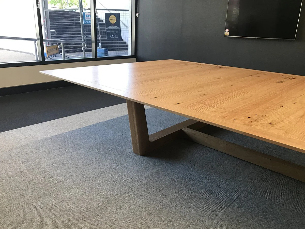 DWER custom furniture in WA Blackbutt - Nathan Day Design, angled corner view of meeting table with black steel base