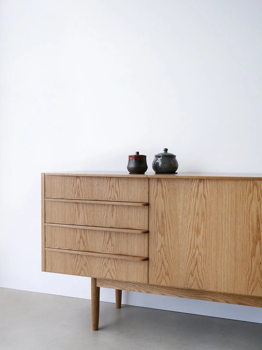 Wembley House Credenza in American Oak, full front view styled with ceramic vases - Nathan Day Design bespoke furniture