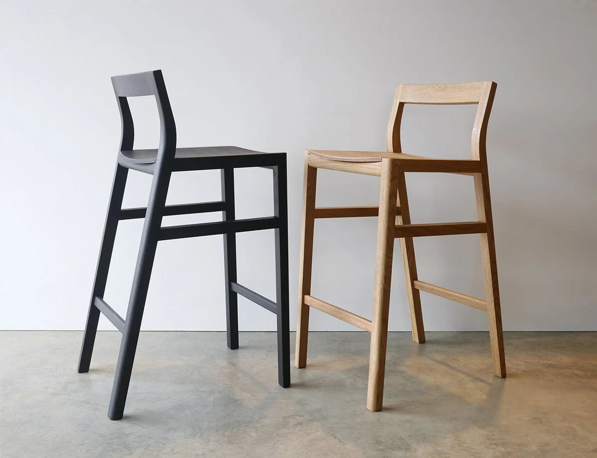 Low-back Bar Stool shown in both ebonised Jarrah and American Oak finishes side by side - Nathan Day Design