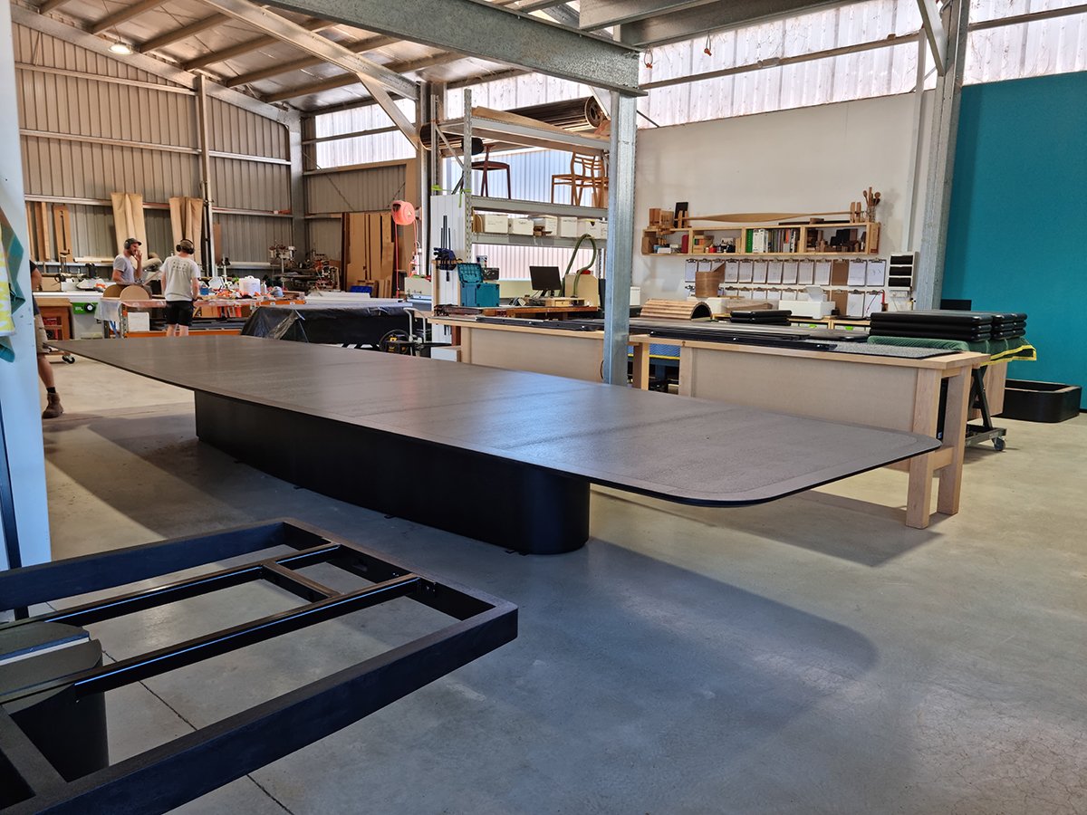 Walters Drive Boardroom Table in ebonised Walnut - Nathan Day Design, angled workshop view showing pedestal base construction