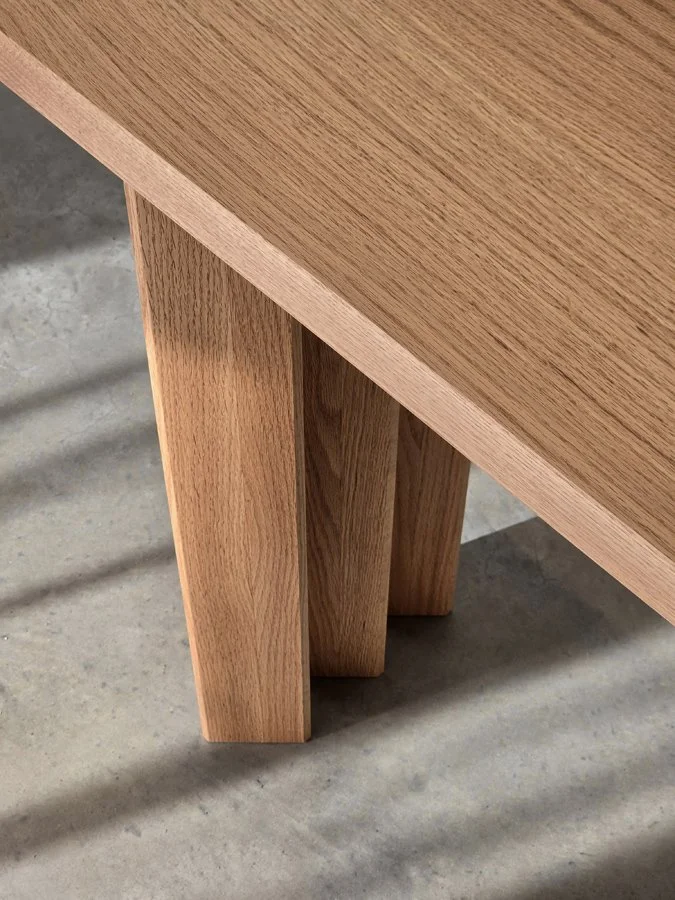 Prism Console in Red Oak, low angled close-up of top edge and legs in sunlight - Nathan Day Design