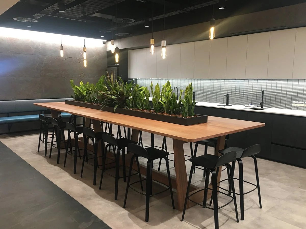 DWER custom furniture in WA Blackbutt - Nathan Day Design, high table with built-in planter box in dark modern kitchenette