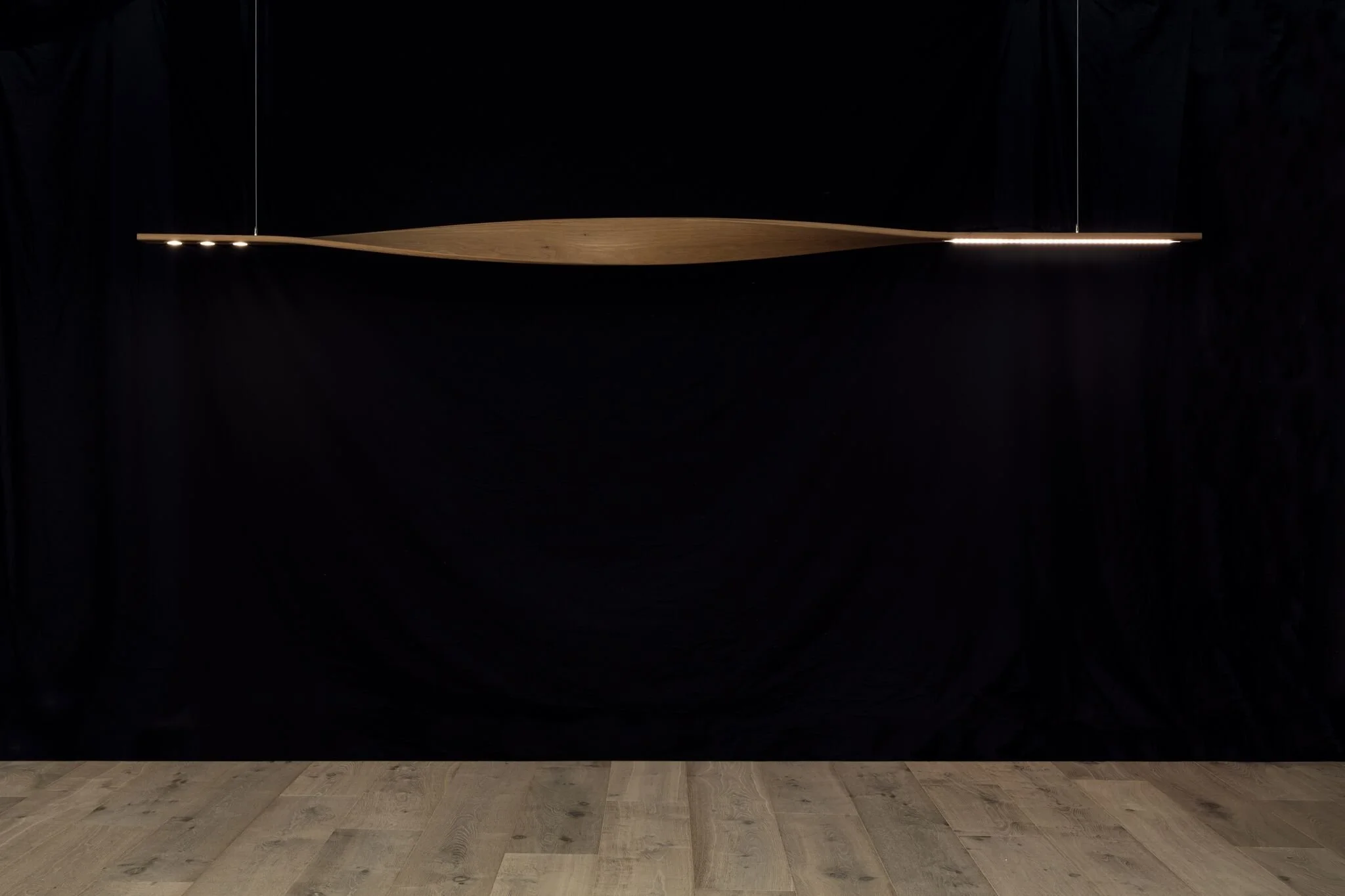 Ernest Pendant Light in Ash, elongated blade-form design - Nathan Day Design, straight-on studio shot against black backdrop