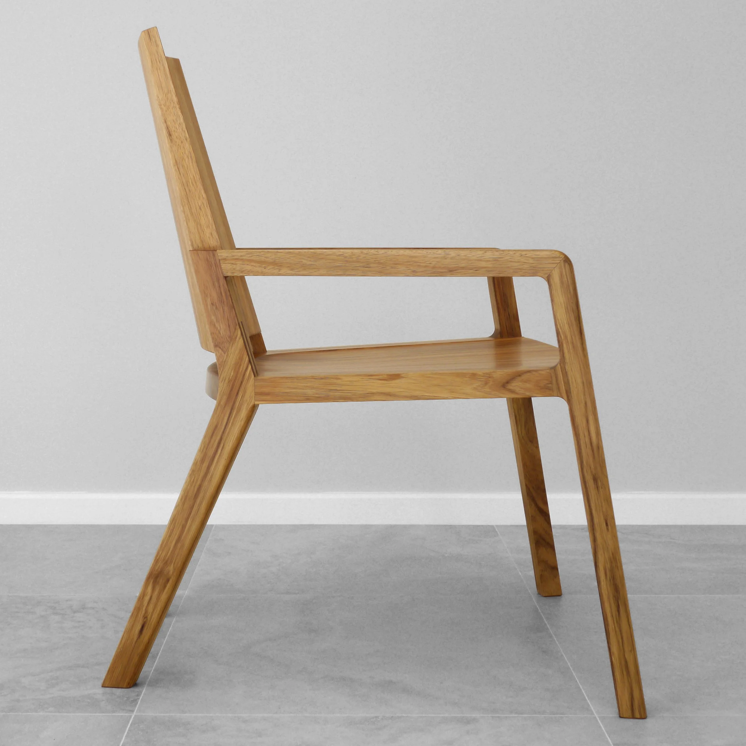 Uluru Chair in Otways Blackwood, Nathan Day Design bespoke furniture - full side view in plain studio setting