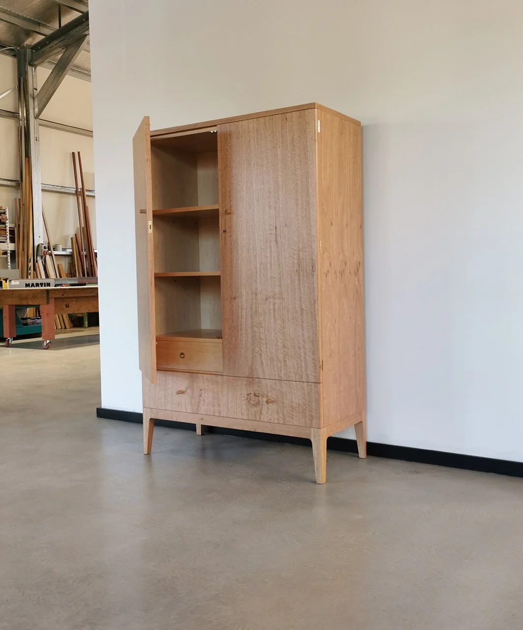Gifford Rd Cabinet in WA Blackbutt, door open showing internal shelving, workshop setting - Nathan Day Design