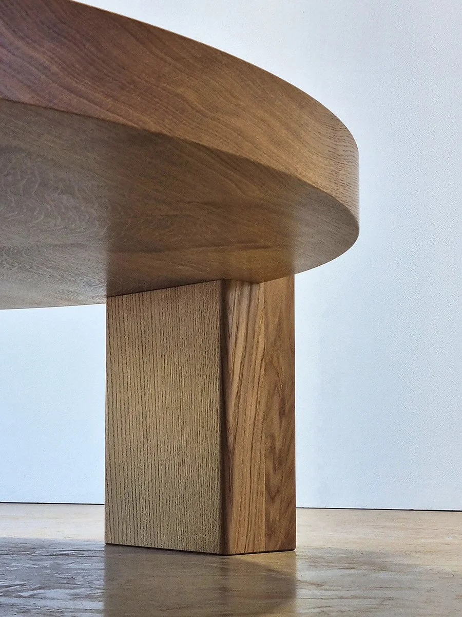 Quindi Coffee Table angled view showing the pedestal base and tabletop underside - bespoke French Oak furniture, Nathan Day Design
