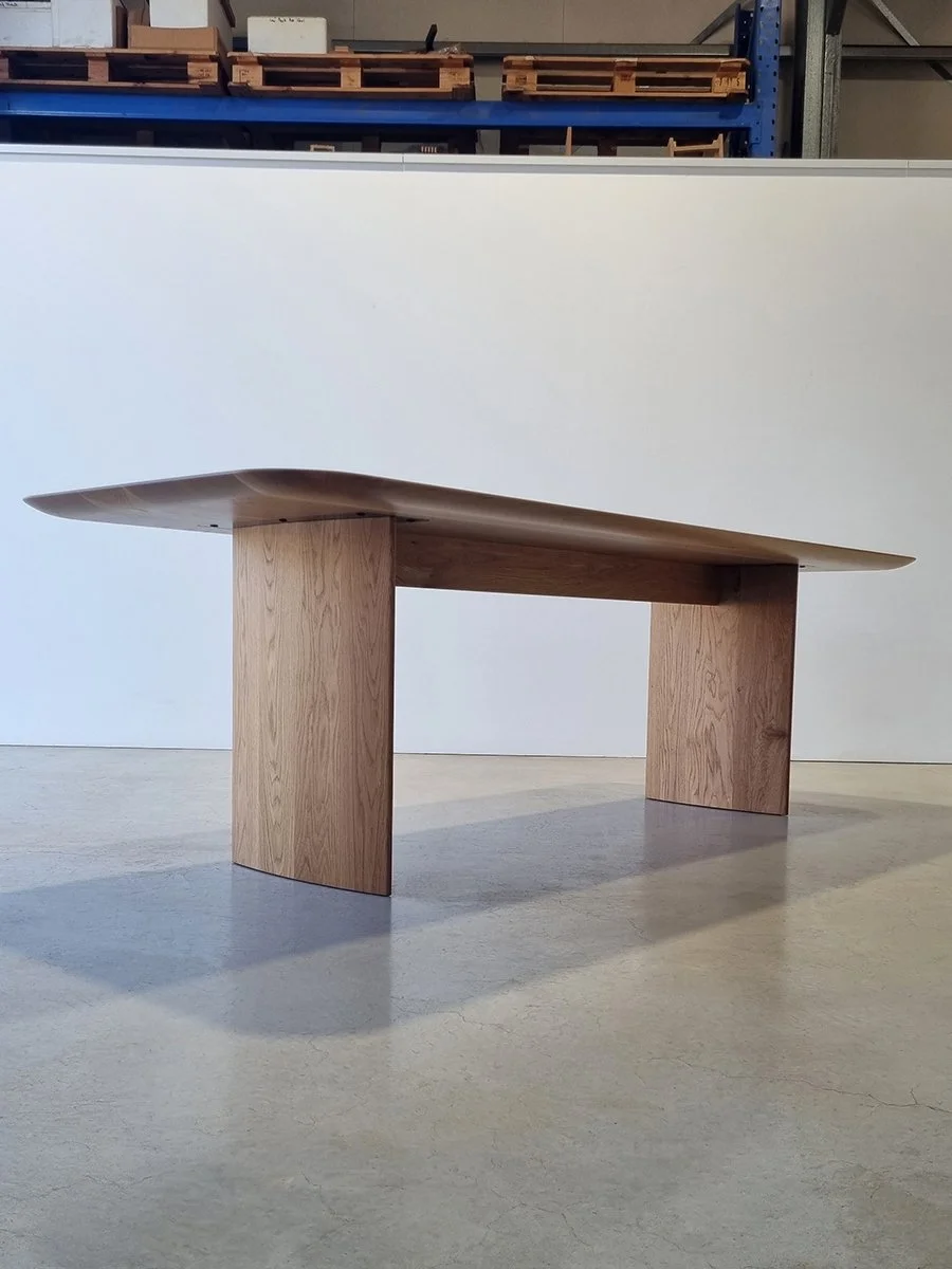 Low-angle view of the Southern Ocean Table showing its thin, weightless-looking top profile - Nathan Day Design