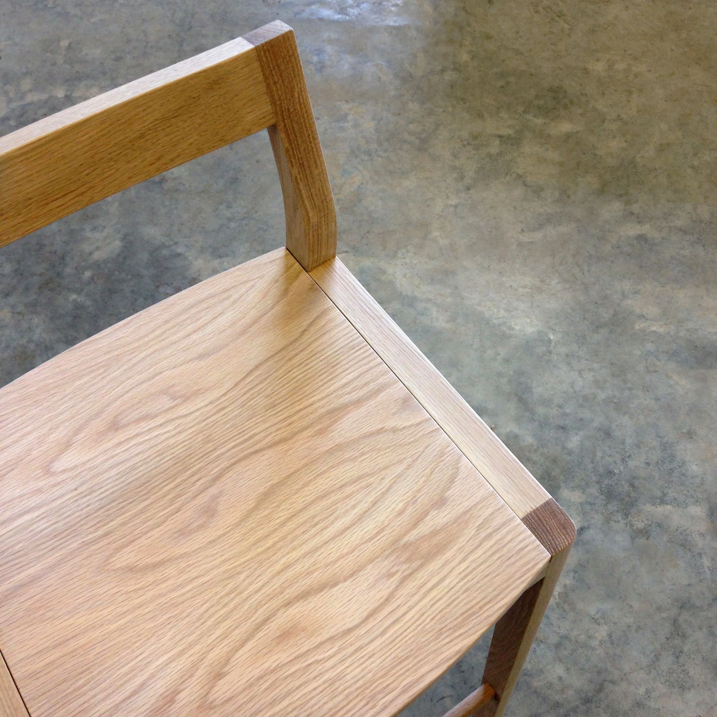 Low-back Bar Stool in American Oak, close-up detail of seat and backrest joinery - Nathan Day Design