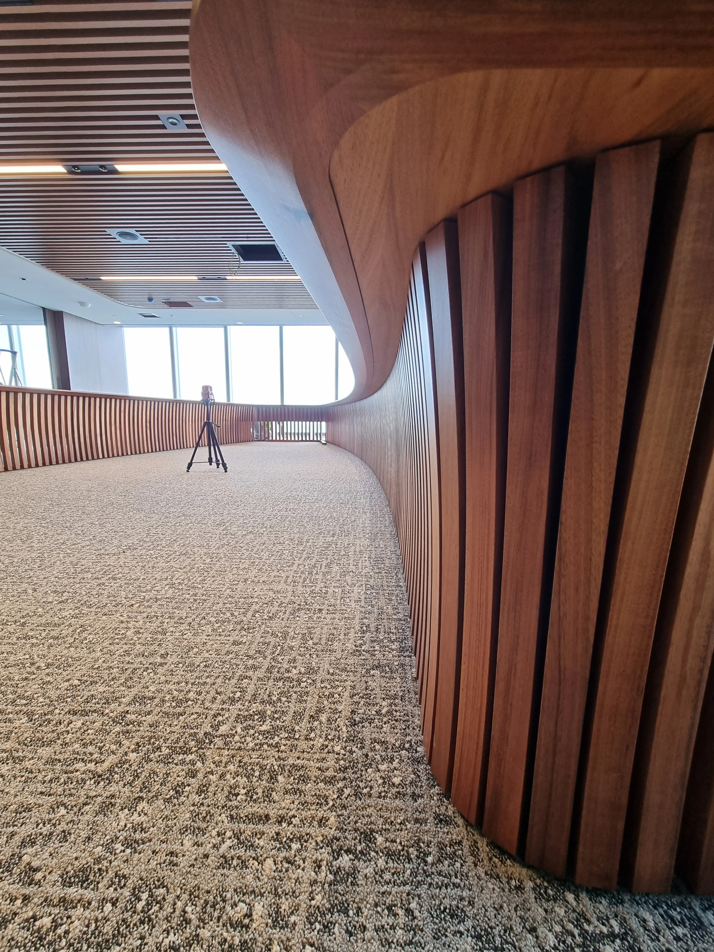 One - The Esplanade Boardroom Table in Australian Blackwood, fluted leg design - Nathan Day Design, wide angled view of sculptural fluted apron curve in finished boardroom