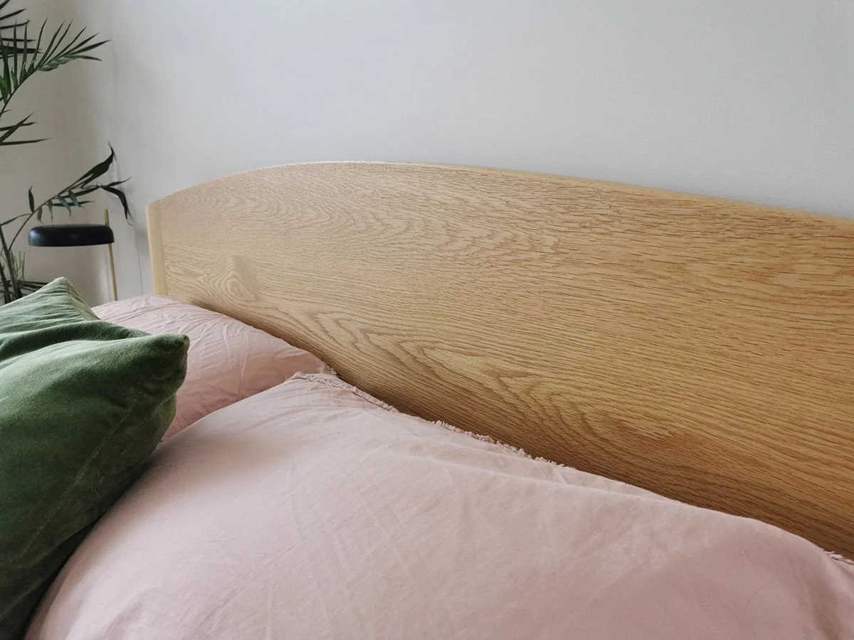 Quindalup Bed in American Oak - Nathan Day Design, angled close-up of headboard curve and joinery