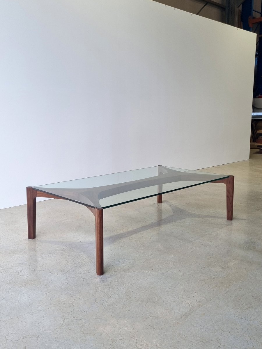 Wende Coffee Table in American Walnut with glass top, angled studio view - bespoke furniture by Nathan Day Design