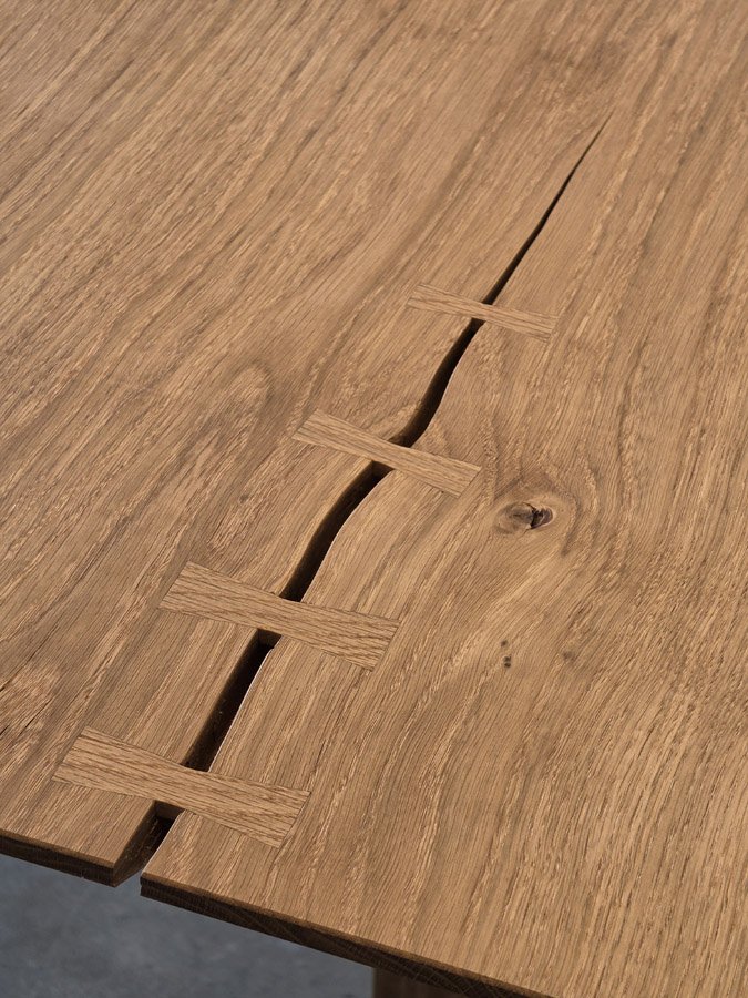 Detail of the Peak Table's bow-tie feature splits reinforcing a natural crack in the Oak slab - Nathan Day Design