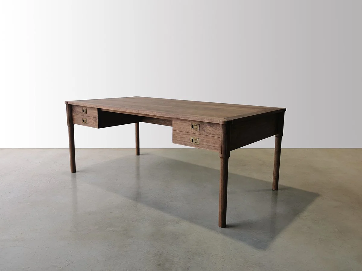 Ventnor Ave Desk in American Walnut, full angled view showing drawer banks in workshop - Nathan Day Design
