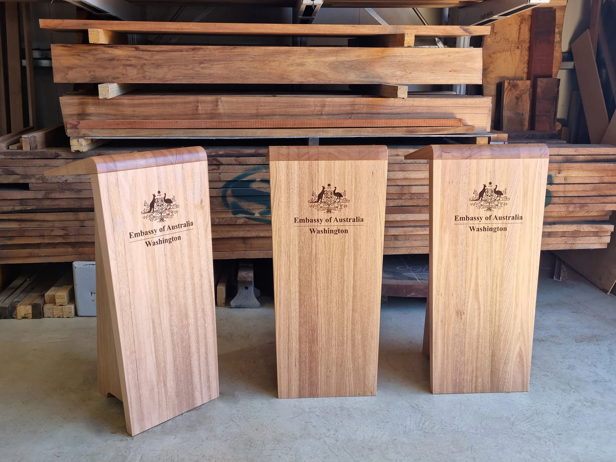 Australian Embassy Lecterns in Tasmanian Oak - Nathan Day Design, three completed lecterns engraved with crest in workshop