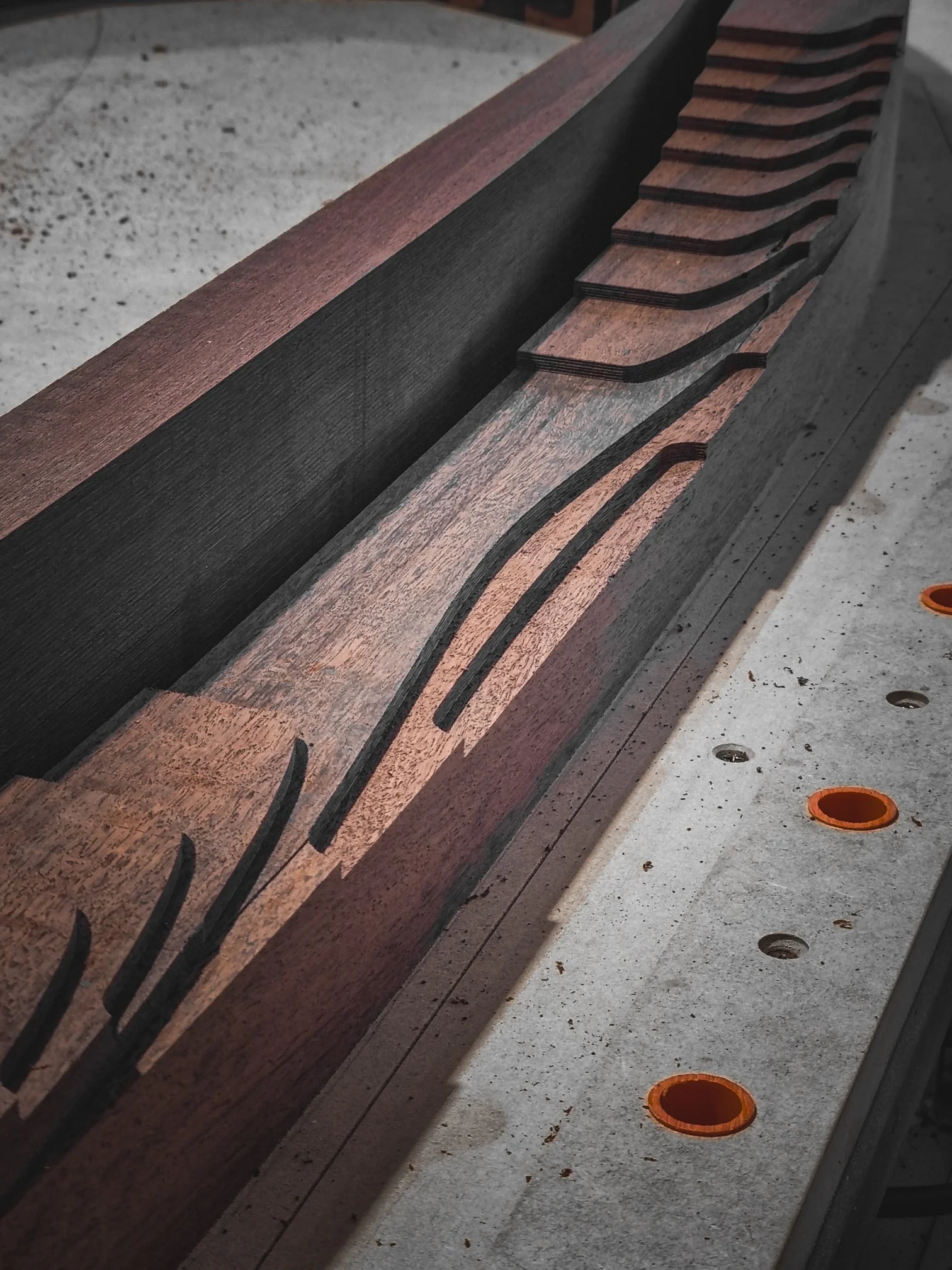 Fluted timber panel curing in a shaping mould, part of the bespoke production process at Nathan Day Design
