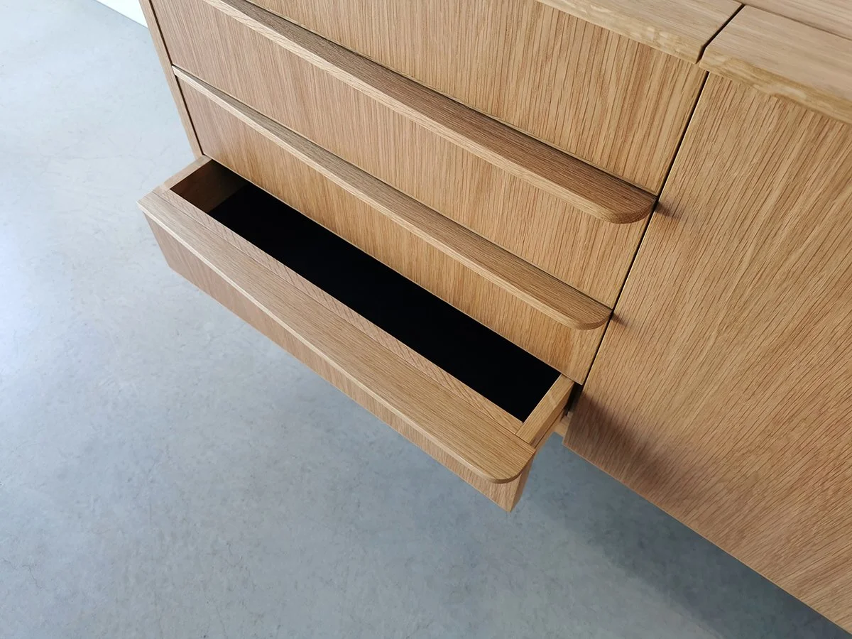 Wembley House Credenza in American Oak, close-up detail of open drawer showing lined interior - Nathan Day Design bespoke furniture