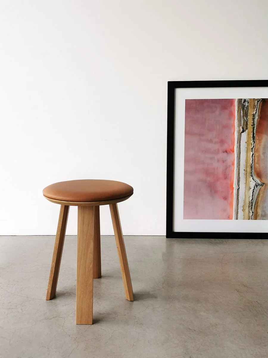 Wonton Stool in American Oak with tan leather seat, single stool studio setting