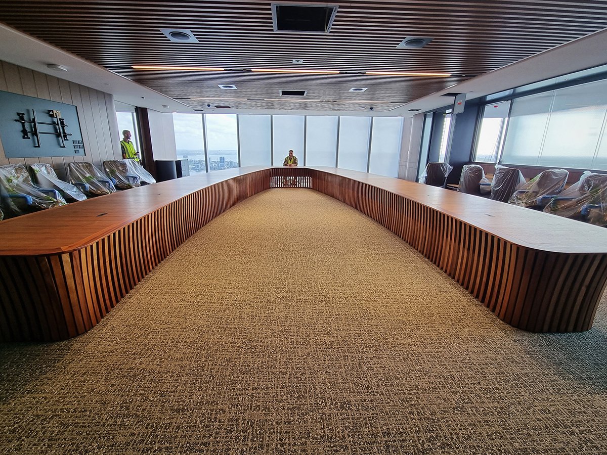 One - The Esplanade Boardroom Table in Australian Blackwood, fluted leg design - Nathan Day Design, opposite end view of finished boardroom with ocean-facing windows