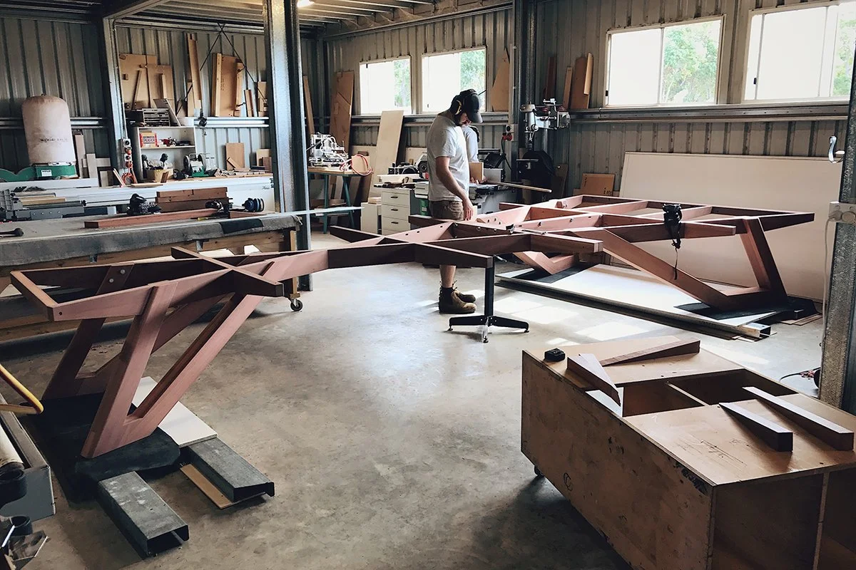 Satterley Boardroom Table in American Walnut, angular V-leg design - Nathan Day Design, angular leg base under construction in workshop