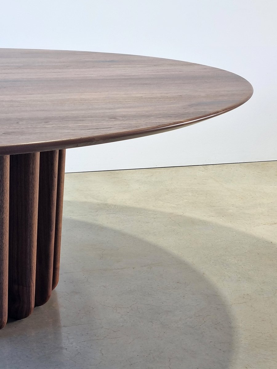 Close-up of the Lantern Table's Walnut tabletop edge meeting the vertical fin base - Nathan Day Design